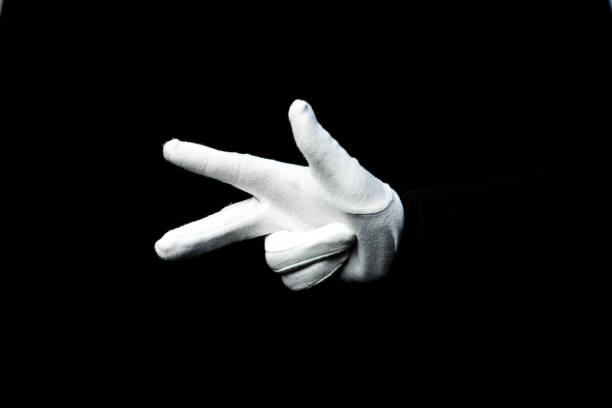 istock A hand wearing white glove on black background counting down 1281272654