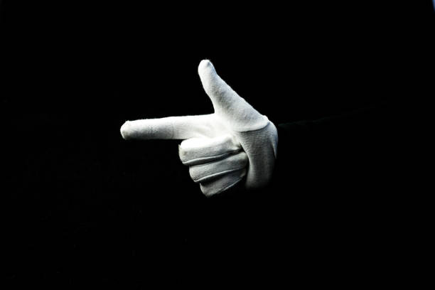 istock A hand wearing white glove on black background showing number 2 sign 1281272661