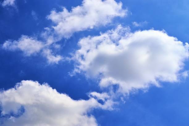 istock Beautiful fluffy white cloud formations in a deep blue summer sky 1281272712