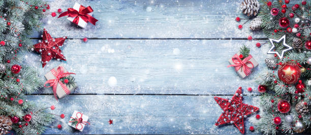istock Fir Branches With Red Ornament And Rustic Giftbox On Snowy Plank - Christmas Background 1281275062