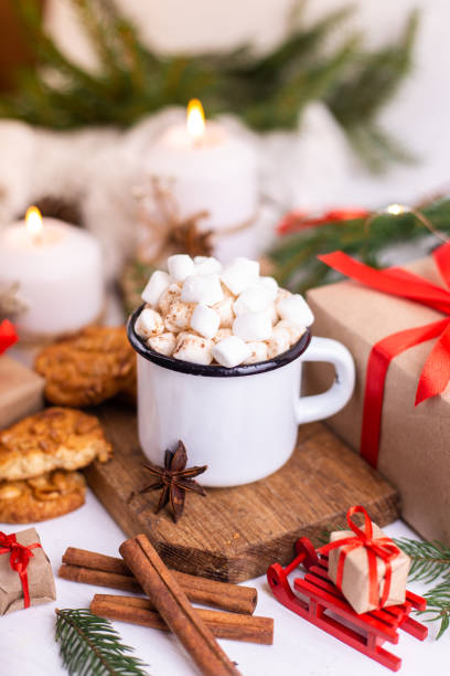 istock Enamelled cup of hot cocoa or coffee with marshmallows and biscuits. 1281275683