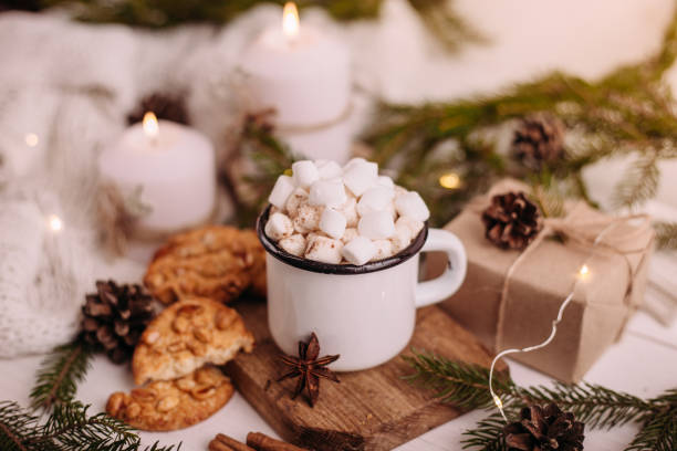 istock Enamelled cup of hot cocoa or coffee with marshmallows and biscuits. 1281275700
