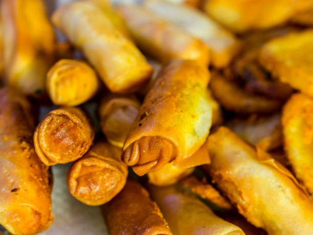 istock Closeup of deep fried Jalapeno cheese sticks made with spring roll wrapper on a glass plate. 1281280426