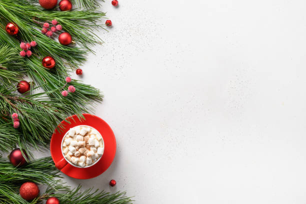 istock Christmas coffee, red decor, evergreen branches on white background with copy space. 1281281482
