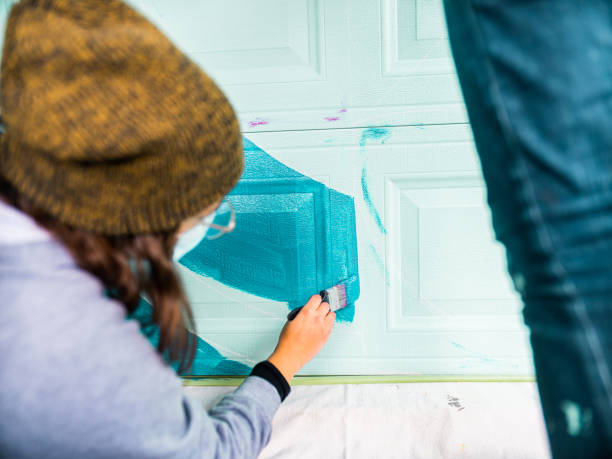 istock Female mural artist at work 1281281874