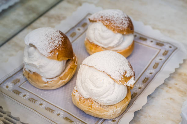 istock Sweet buns with cream in the window of a bakery 1281282567