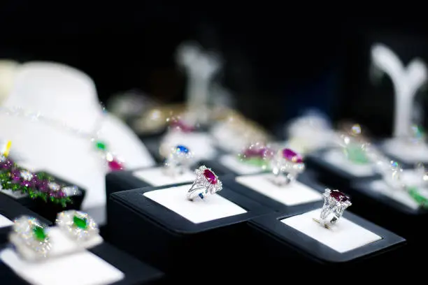 Photo of jewelry gemstones rings in window display boutique