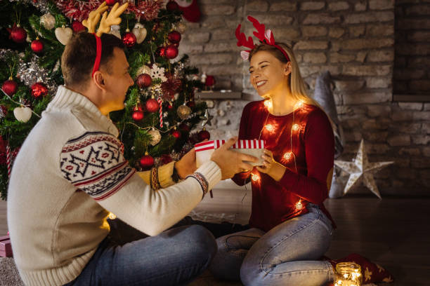 istock Couple exchanging Christmas presents 1281284086