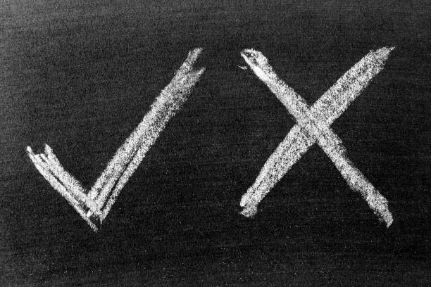istock White color chalk hand drawing in check mark of right and wrong shape on black board background 1281286193