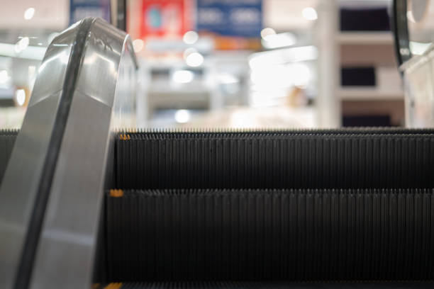 istock Escalator moving up to department mall area. 1281286758