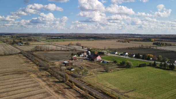 istock Small farm in the middle of many fields 1281286841