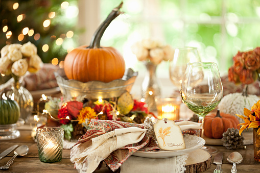 Thanksgiving dining table elegant place setting. Very shallow depth