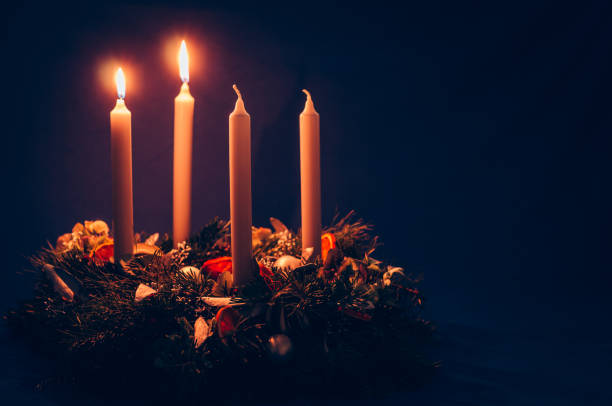 2. advent candle burning on advent wreath stock photo