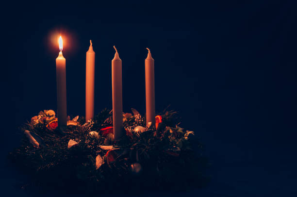 1. advent candle burning on advent wreath 4 candle advent wreath on black background copy space advent photos stock pictures, royalty-free photos & images