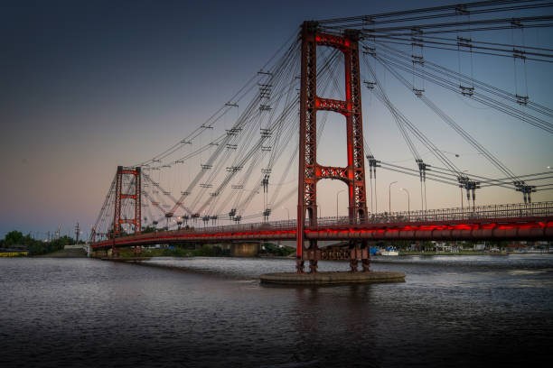 istock Silhouette Martial Pendant Bridge Candioti Over Santa Fe River Against Sky. 1281291883