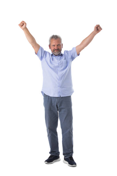 Handsome senior man over isolated background celebrating surprised and amazed for success with arms raised and open eyes. Winner concept.