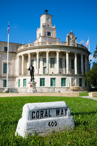 Coral Way street sign and classic architecture of the City Hall building in Coral Gables in Miami, Florida.