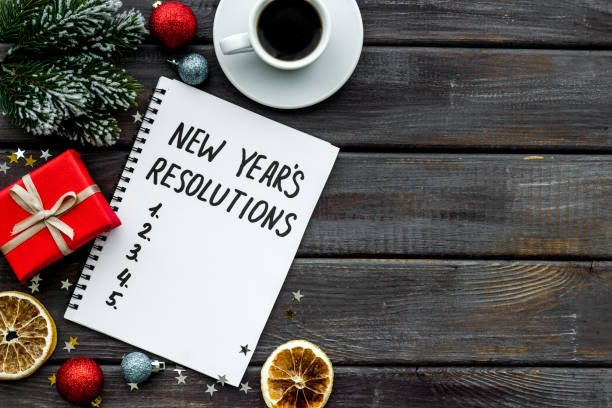 istock 2021 New Year's resolutions with Christmas decorations. Overhead view 1281293669