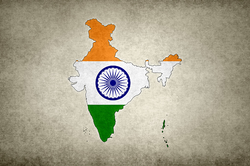 Grunge map of India with its flag printed within its border on an old paper.
