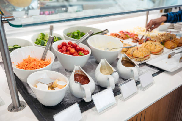 istock Salad bar with variety sauce, topping vegetables and bread on the buffet table 1281296914