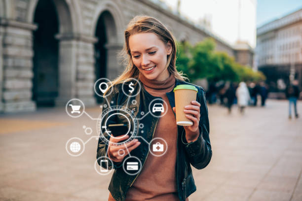 Artificial intelligence and communication network concept. Beautiful young woman using a smartphone with various icons of smart technology. digital price stock pictures, royalty-free photos & images
