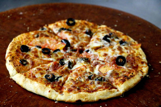 istock portrait view of cooked pizza 1281298802