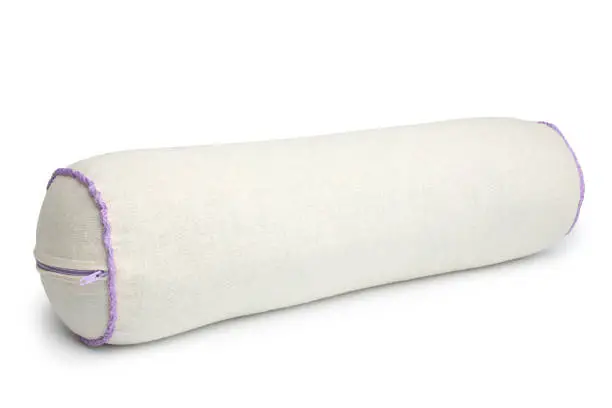 Roll orthopedic pillow with buckwheat husk on white background