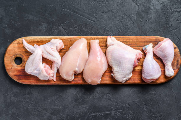 istock Different types of raw chicken meat, poultry. Black background. Top view 1281300918