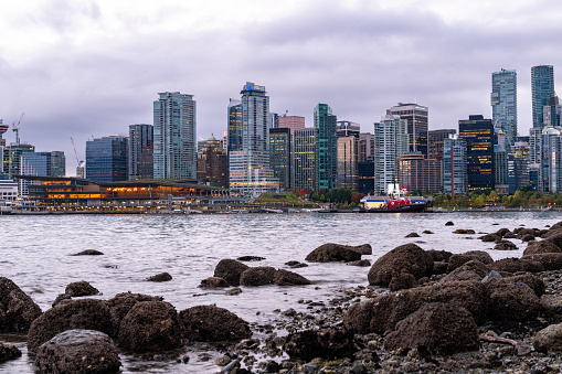 July 1, 2022, Young woman enjoying the view of False Creek on Granville Bridge on Canada Day, Vancouver, Canada