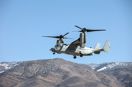 Bishop Airport (KBIH),Bishop California, USA, May 8, 2014.   United States Marine Corps Osprey MV-22 Aircraft from Marine Squadrons, VMM-161 and VMM-162 perform high altitude landing and launching training.\n\nBishop Airport, (KBIH)  was built in 1928 and expanded and operated by the Army Air Corps during WWII.  During the war it was used as a military flight training base and boasted a chow hall and barracks for pilots during training.  Because of its strategic location east of the 12,000 foot tall Sierra Nevada Mountain range Bishop would be used as a Fall Back Base in the event the Japanese military attacked the California coast. \n  \nToday the airport has multiple modern navigational aids and is used by civilian aircraft and all branches of the US military for training and fuel stops.  Bishop has a military fuel contract which allows any military aircraft to purchase fuel.  Because of its close proximity to the Marine Corps High Altitude Training Facility at Pickle Meadows, Bishop is a vital fuel stop.  Aircraft leave their bases on the California coast fully laden with troops and after depositing them at Pickle Meadows stop at Bishop for fuel.  \n\n Aircraft perform differently at higher altitudes than at sea level.  Performance is affected by altitude, weight and available power.  Fuel, cargo and passenger loads must be calculated based on altitude, weight and aircraft power.  On a 100 degree day at Bishop's 4,200 foot elevation an aircraft will perform as though it was launching from an airport located 8,000 feet above sea level.  This phenomena is known as Density Altitude.  During workups for deployment to Afghanistan military air units practice in and around the Bishop area because of the high elevation of the airport, sparse population and similarity of terrain.  Copyright Kenneth Babione