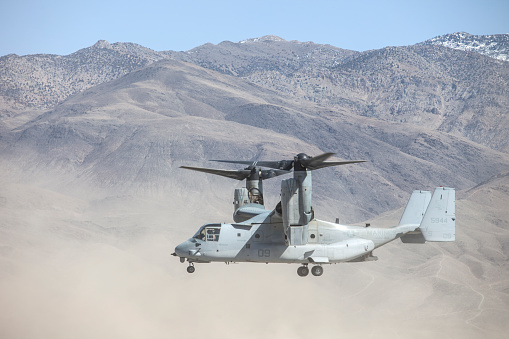 Bishop Airport (KBIH),Bishop California, USA, May 8, 2014.   United States Marine Corps Osprey MV-22 Aircraft from Marine Squadrons, VMM-161 and VMM-162 perform high altitude landing and launching training.\n\nBishop Airport, (KBIH)  was built in 1928 and expanded and operated by the Army Air Corps during WWII.  During the war it was used as a military flight training base and boasted a chow hall and barracks for pilots during training.  Because of its strategic location east of the 12,000 foot tall Sierra Nevada Mountain range Bishop would be used as a Fall Back Base in the event the Japanese military attacked the California coast. \n  \nToday the airport has multiple modern navigational aids and is used by civilian aircraft and all branches of the US military for training and fuel stops.  Bishop has a military fuel contract which allows any military aircraft to purchase fuel.  Because of its close proximity to the Marine Corps High Altitude Training Facility at Pickle Meadows, Bishop is a vital fuel stop.  Aircraft leave their bases on the California coast fully laden with troops and after depositing them at Pickle Meadows stop at Bishop for fuel.  \n\n Aircraft perform differently at higher altitudes than at sea level.  Performance is affected by altitude, weight and available power.  Fuel, cargo and passenger loads must be calculated based on altitude, weight and aircraft power.  On a 100 degree day at Bishop's 4,200 foot elevation an aircraft will perform as though it was launching from an airport located 8,000 feet above sea level.  This phenomena is known as Density Altitude.  During workups for deployment to Afghanistan military air units practice in and around the Bishop area because of the high elevation of the airport, sparse population and similarity of terrain.  Copyright Kenneth Babione