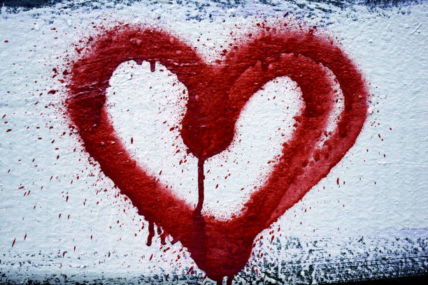 istock Graffiti heart outline spray-painted on concrete. 1281302879