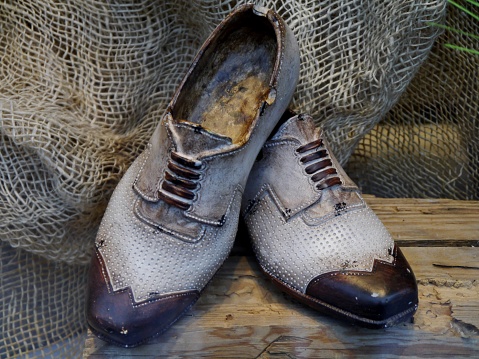 Men's shoes on wooden surface as decoration