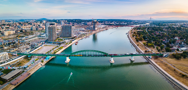 Aerial skyline of Belgrade waterfront and row of bridges over Sava river in the capital city of Serbia sunset. Landmark city view and Europe travel abstract