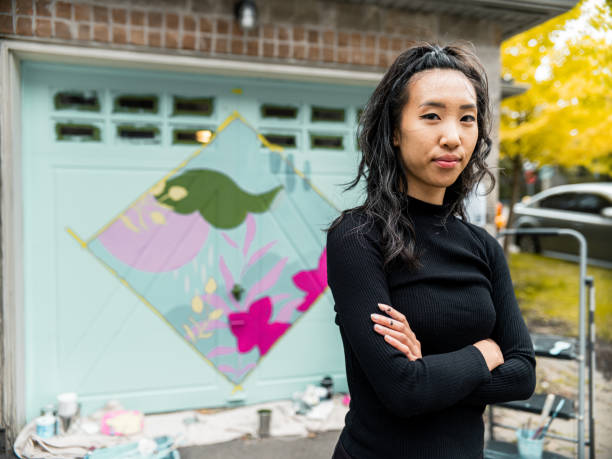 istock Female mural artist at work 1281303613
