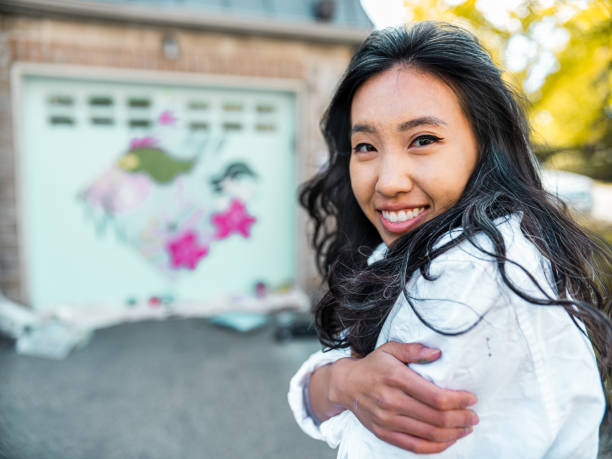istock Female mural artist at work 1281304208