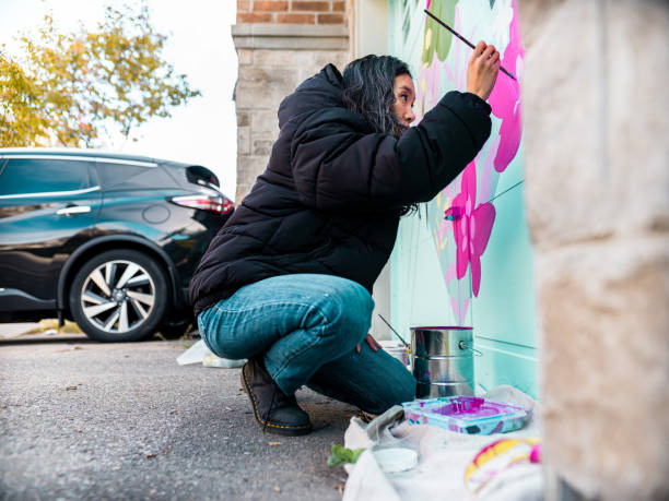 istock Female mural artist at work 1281304505