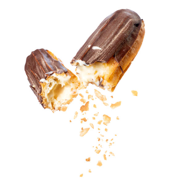 istock Delicious chocolate eclair broken into two halves in the air close-up, isolated on a white background 1281304559