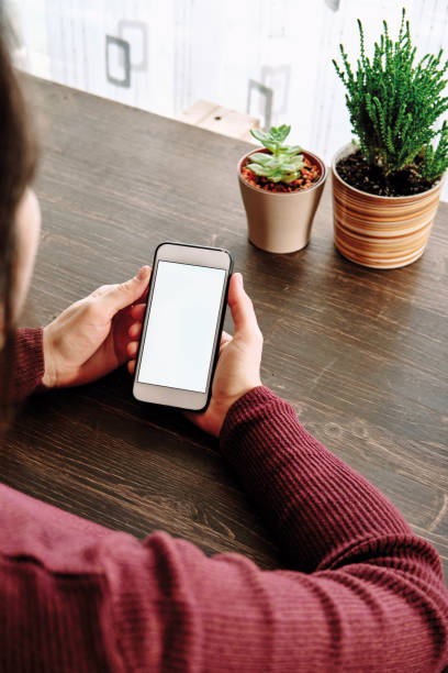 istock Woman using smart phone. Human hand and smart phone close-up shooting. 1281304790