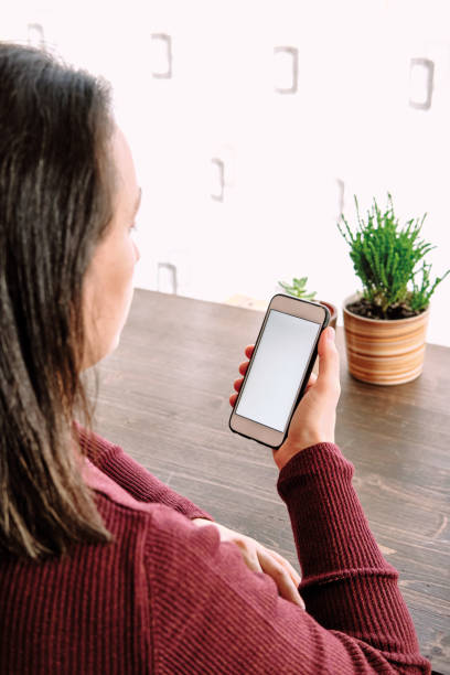 istock Woman using smart phone. Human hand and smart phone close-up shooting. 1281304808