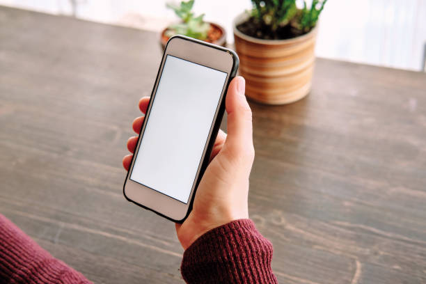 istock Woman using smart phone. Human hand and smart phone close-up shooting. 1281304826