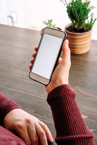 istock Woman using smart phone. Human hand and smart phone close-up shooting. 1281304833