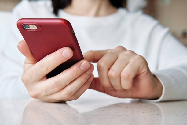 istock Woman using smart phone. Human hand and smart phone close-up shooting. 1281304855