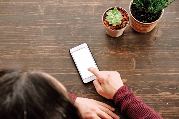 istock Woman using smart phone. Human hand and smart phone close-up shooting. 1281304868
