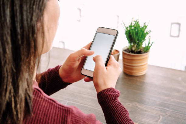 istock Woman using smart phone. Human hand and smart phone close-up shooting. 1281304877