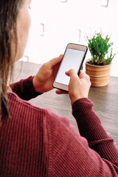 istock Woman using smart phone. Human hand and smart phone close-up shooting. 1281304880
