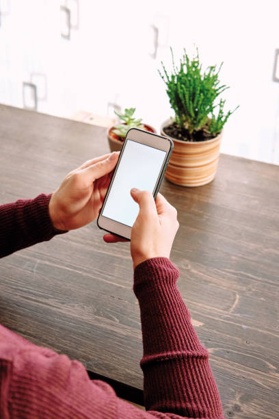 istock Woman using smart phone. Human hand and smart phone close-up shooting. 1281304963