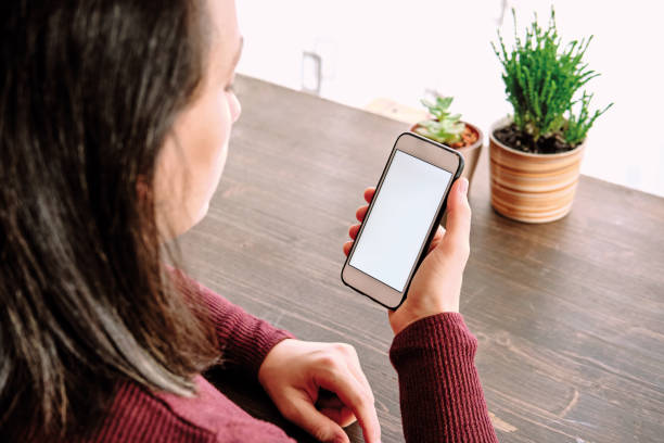 istock Woman using smart phone. Human hand and smart phone close-up shooting. 1281304966