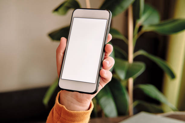 istock 6-7 years child holding and touching smart phone. Smart phone screen is empty. 1281305046