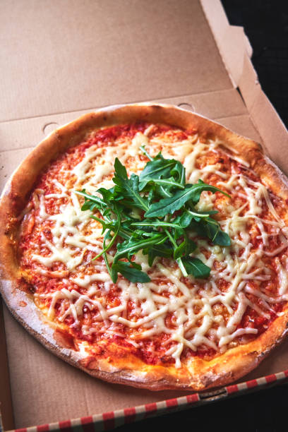 istock Vegetarian Pizza with Tomato and Arugula 1281305793
